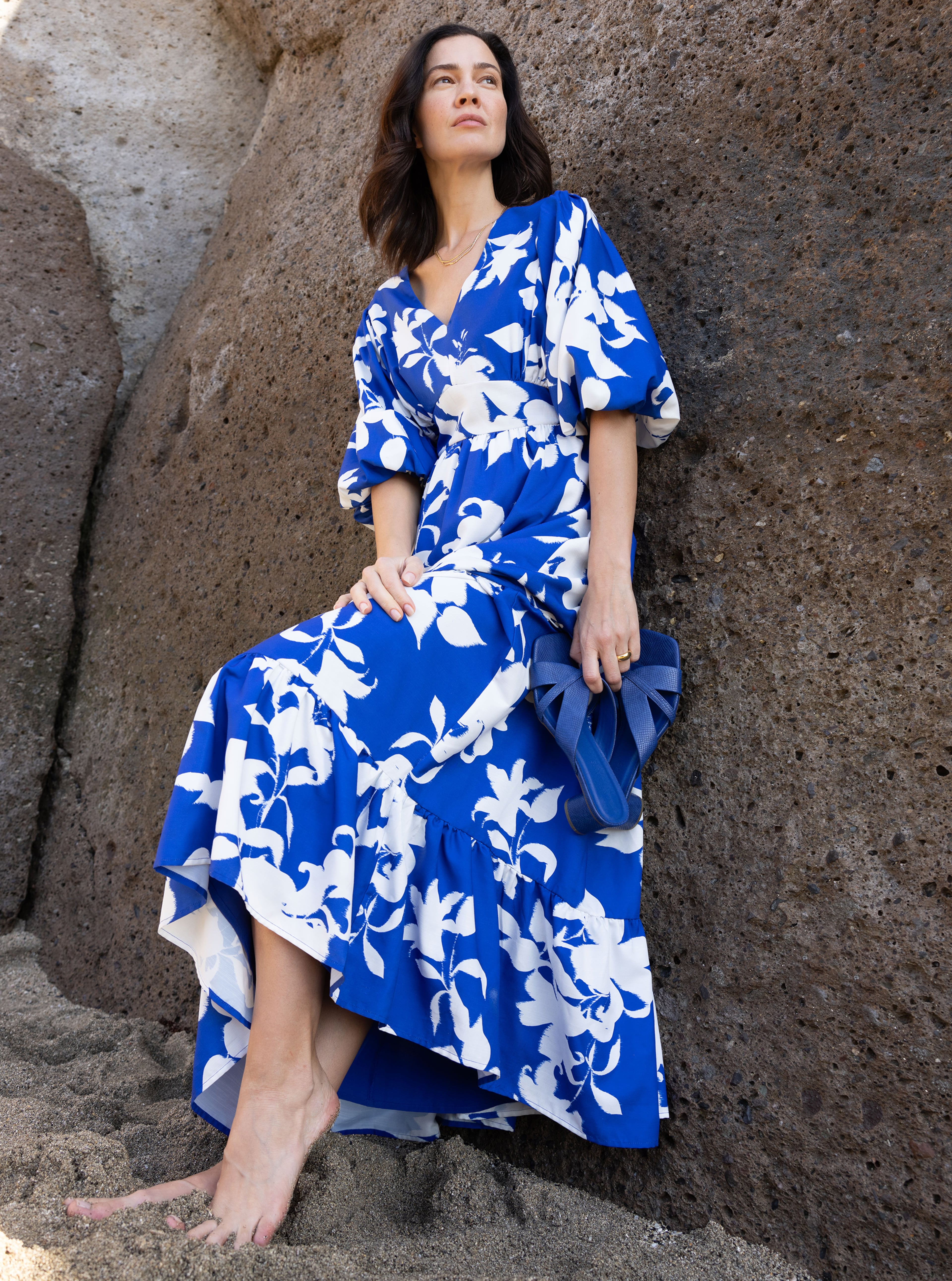 A woman wearing a royal blue and white dress
