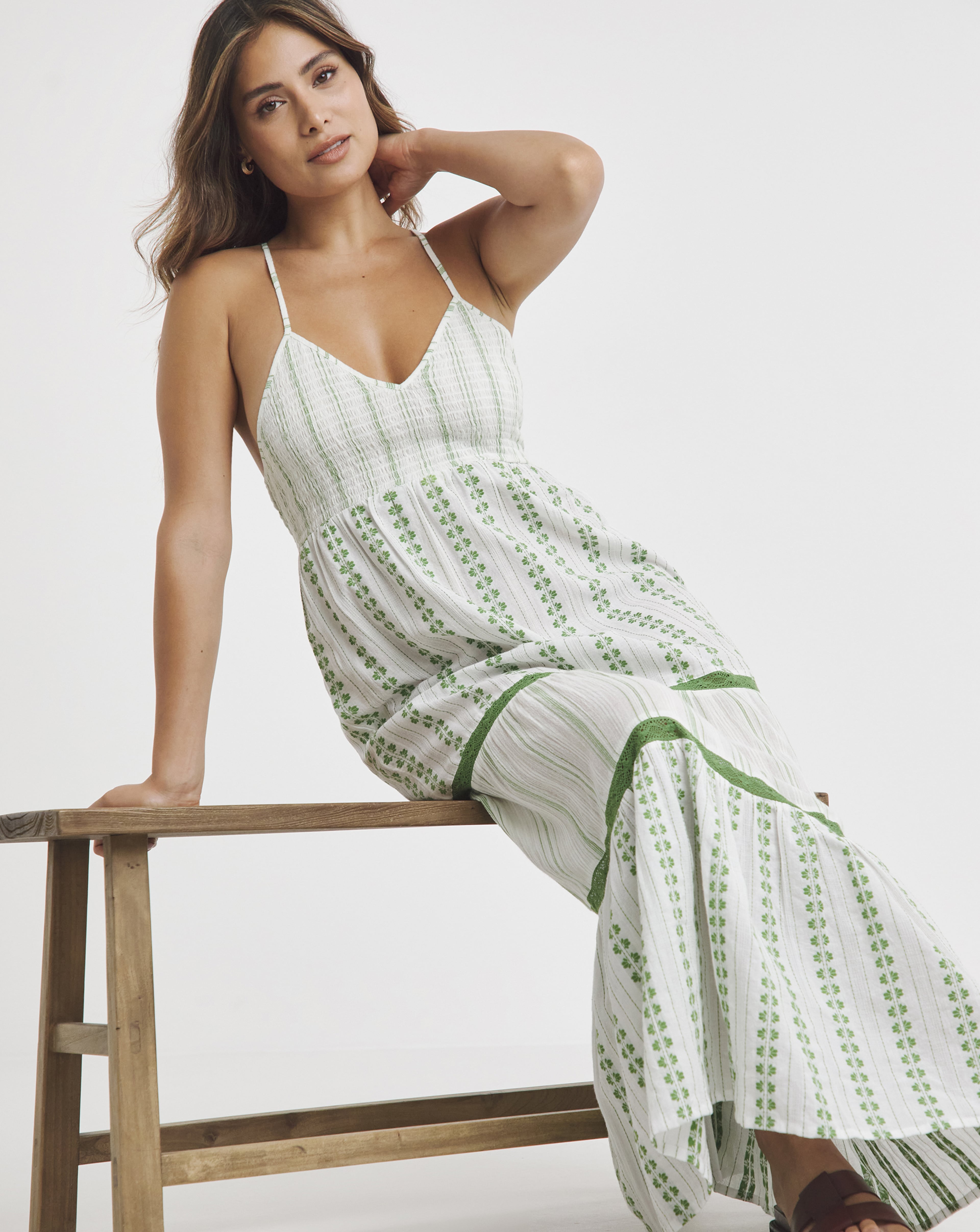 A woman wearing a light green summer dress